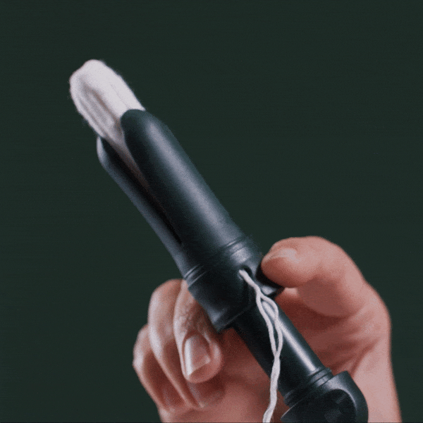 Reusable Tampon Applicator by DAME in dark green with packaging. Eco-friendly, medical-grade design for sustainable feminine care.
